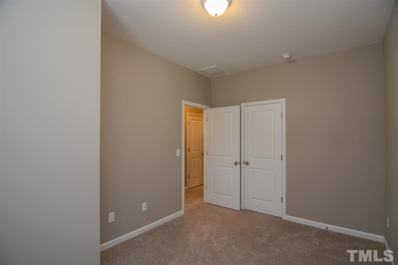 697 Wickham Ridge Road Apex, NC 27539 - Photo 16 of 25 a view of an empty room