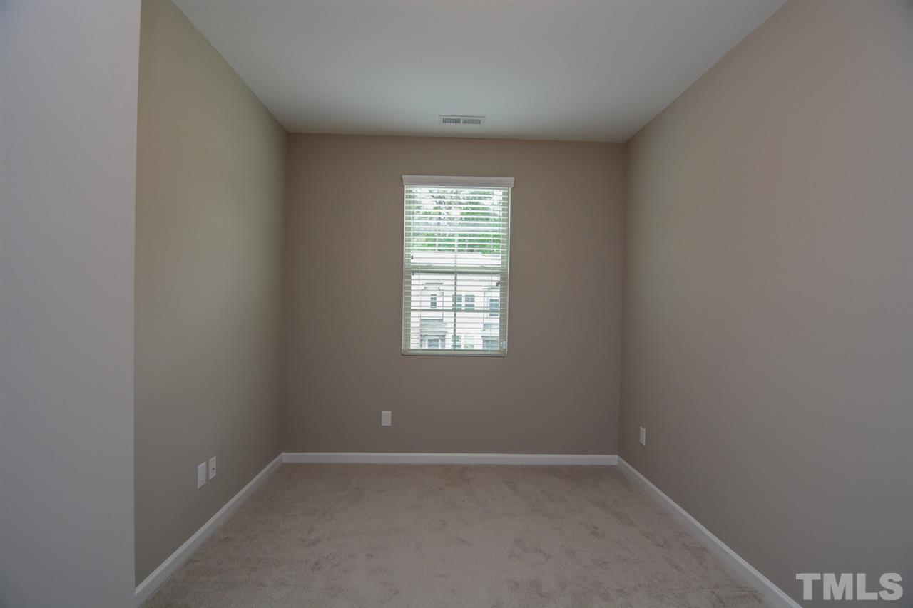 697 Wickham Ridge Road Apex, NC 27539 - Photo 17 of 25 an empty room with a window