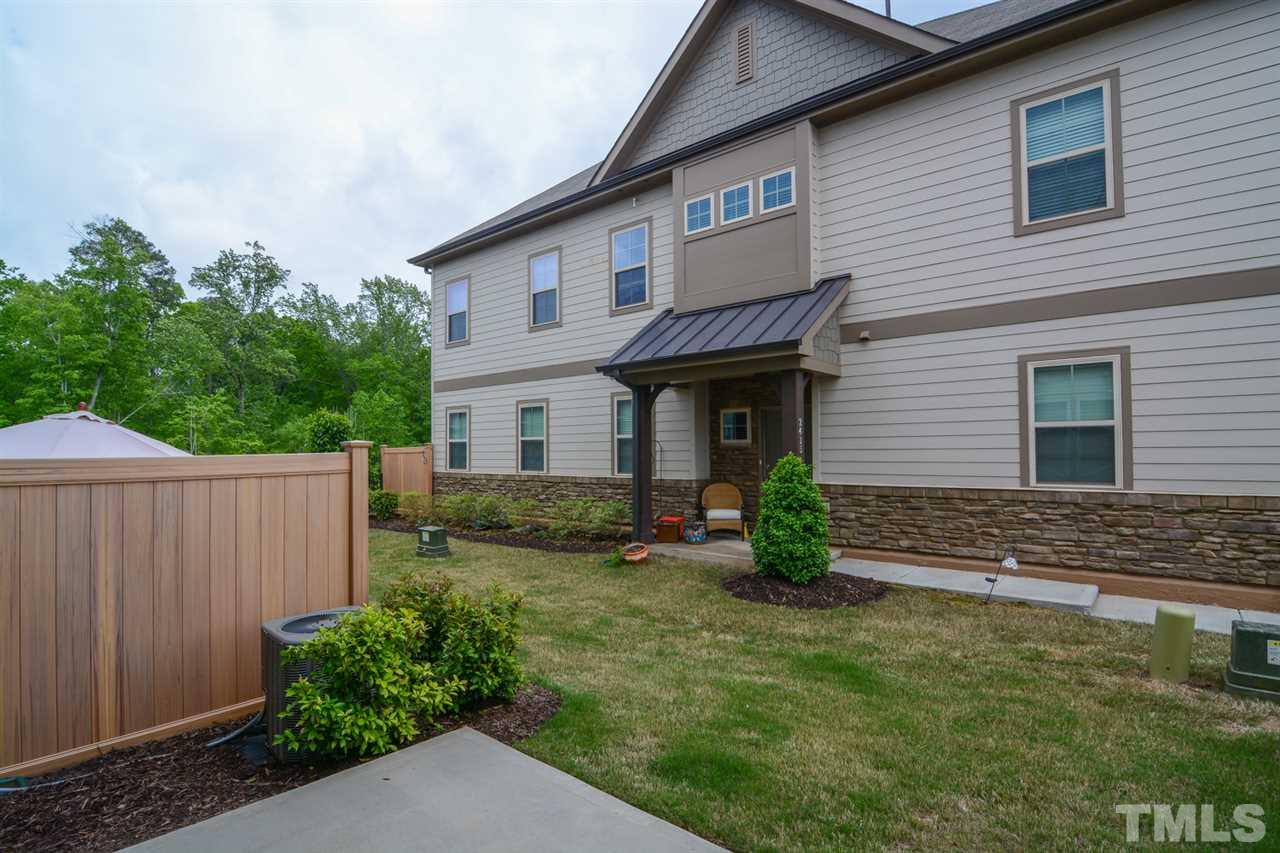 697 Wickham Ridge Road Apex, NC 27539 - Photo 22 of 25 a view of a house with a yard