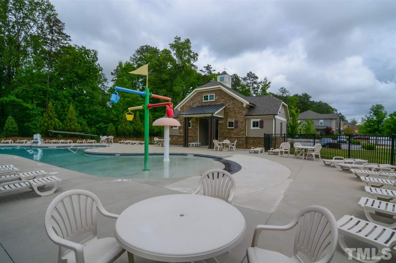 697 Wickham Ridge Road Apex, NC 27539 - Photo 24 of 25 a view of a house with backyard porch and sitting area