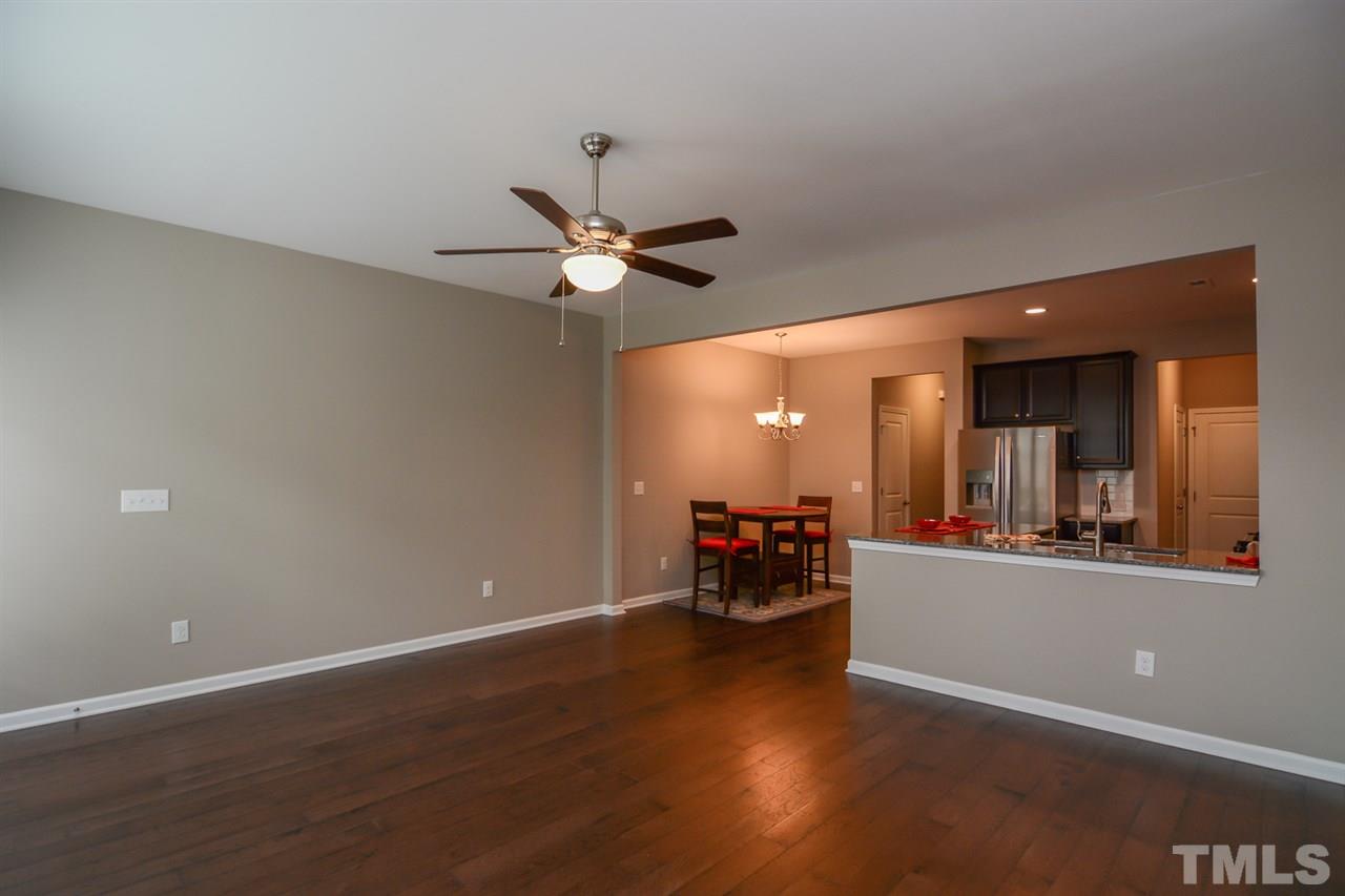 697 Wickham Ridge Road Apex, NC 27539 - Photo 8 of 25 an outdoor space with furniture and a ceiling fan