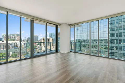 a view of a room with wooden floor and balcony