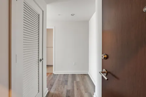 a view of a room with wooden floor