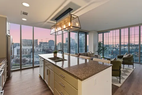 a kitchen with granite countertop a sink and counter top space