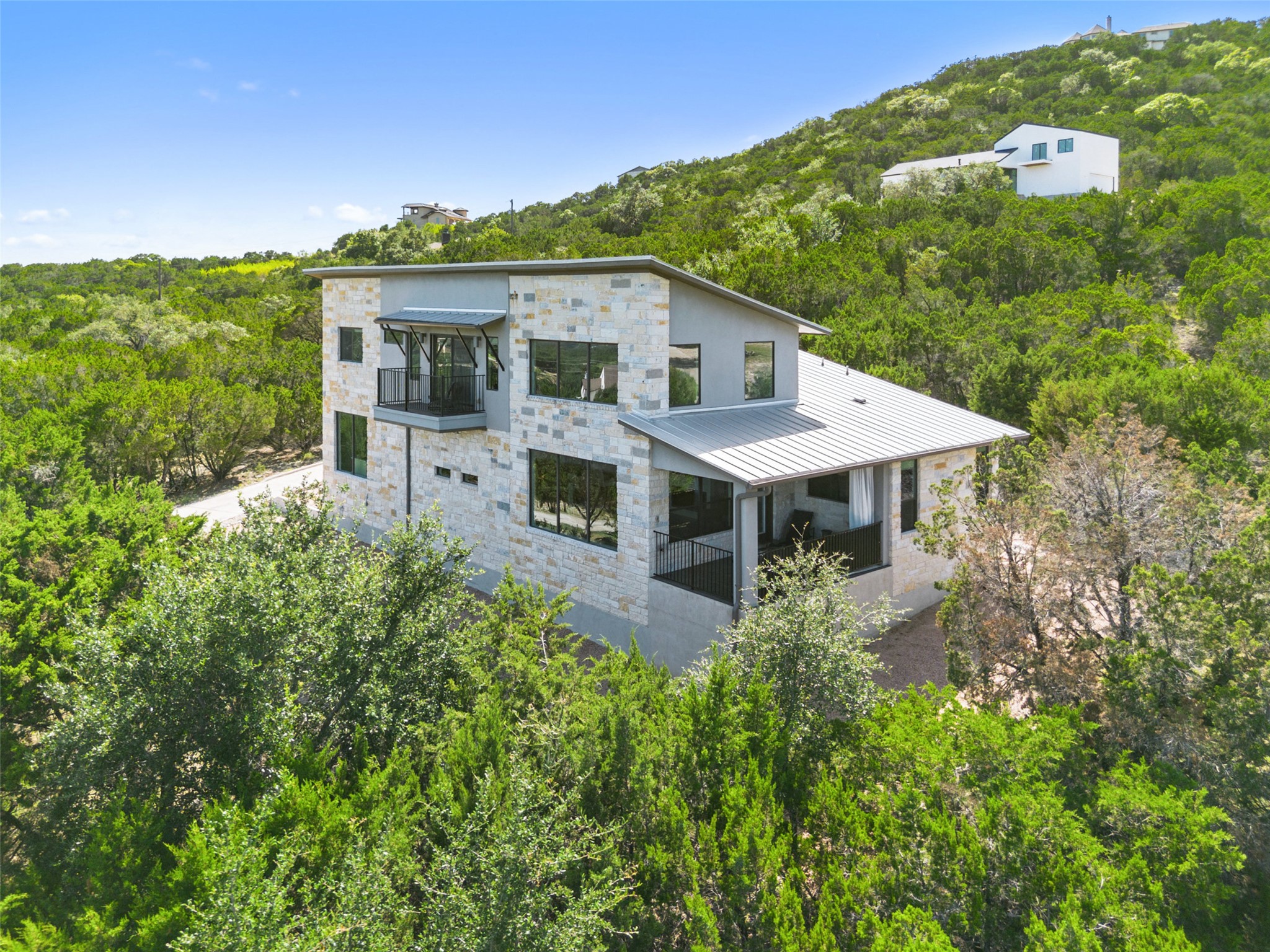 stone siding, and a metal roof