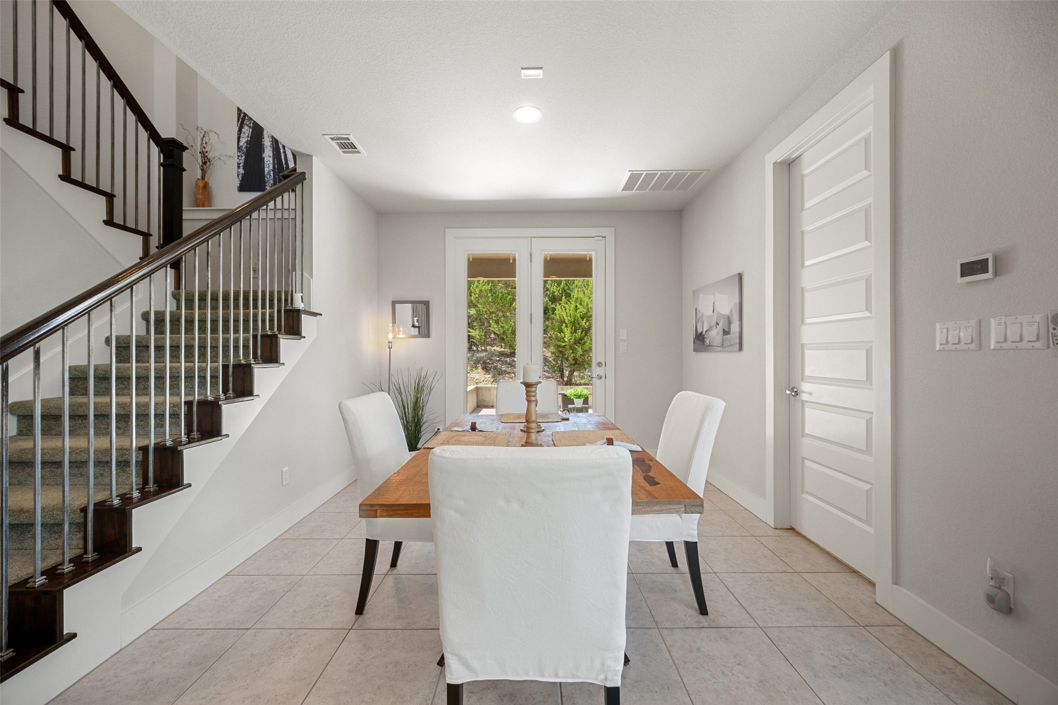 17644 West Reed Park Road Jonestown, TX 78645 - Photo 11 of 36 a dining room with furniture staircase and a livingroom with furniture