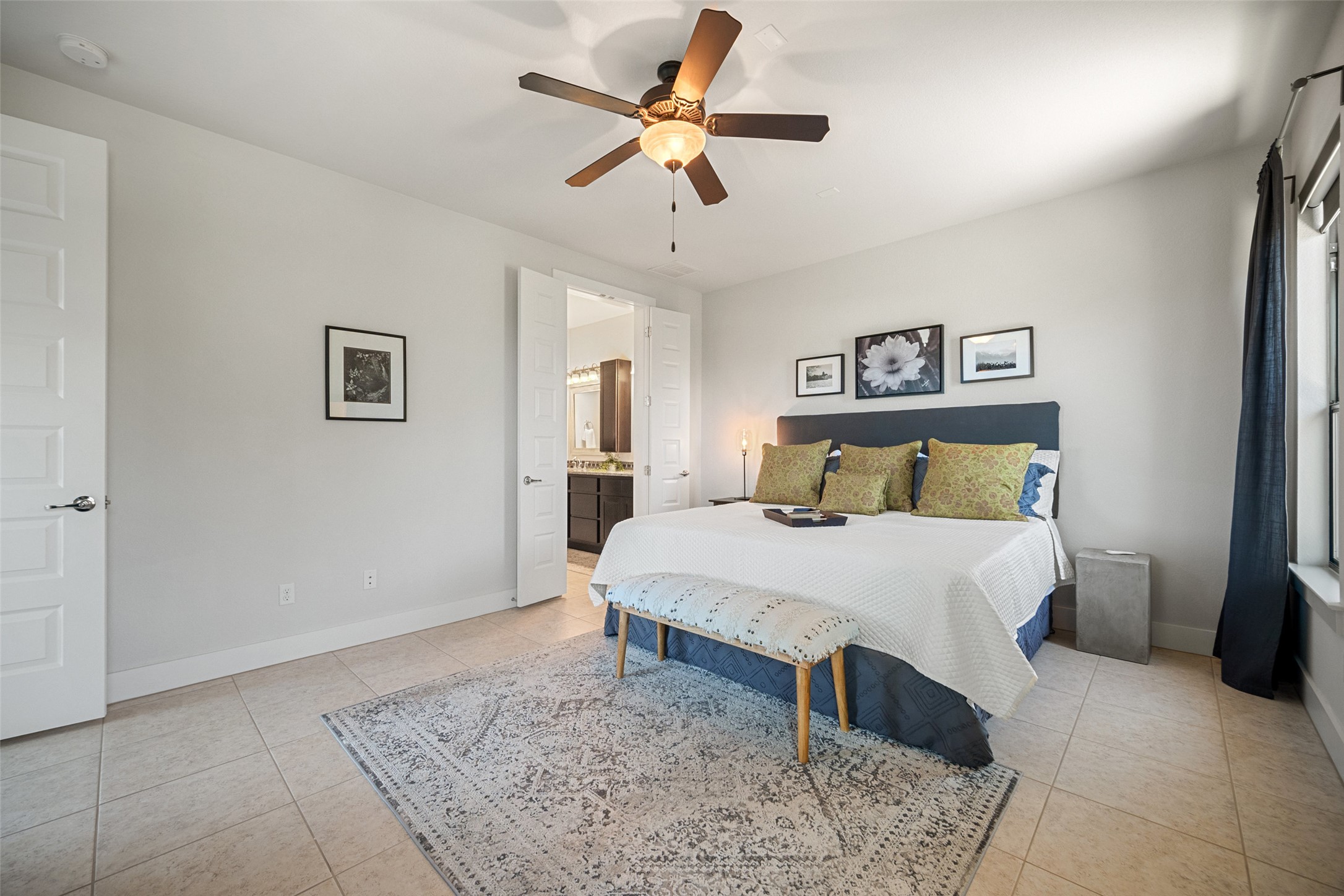 17644 West Reed Park Road Jonestown, TX 78645 - Photo 17 of 36 a bedroom with a bed and a ceiling fan