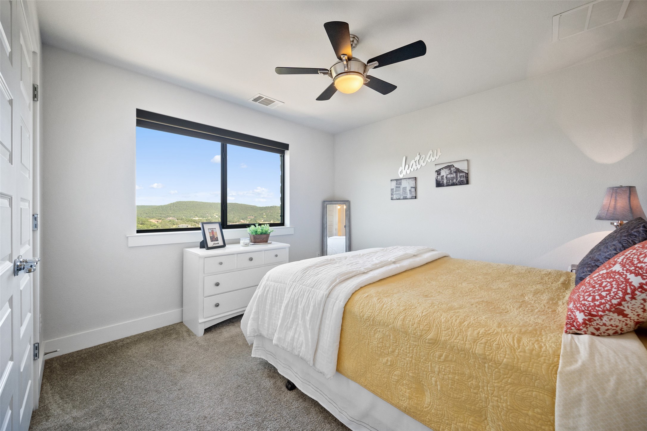 17644 West Reed Park Road Jonestown, TX 78645 - Photo 25 of 36 a bedroom with a large bed and a window