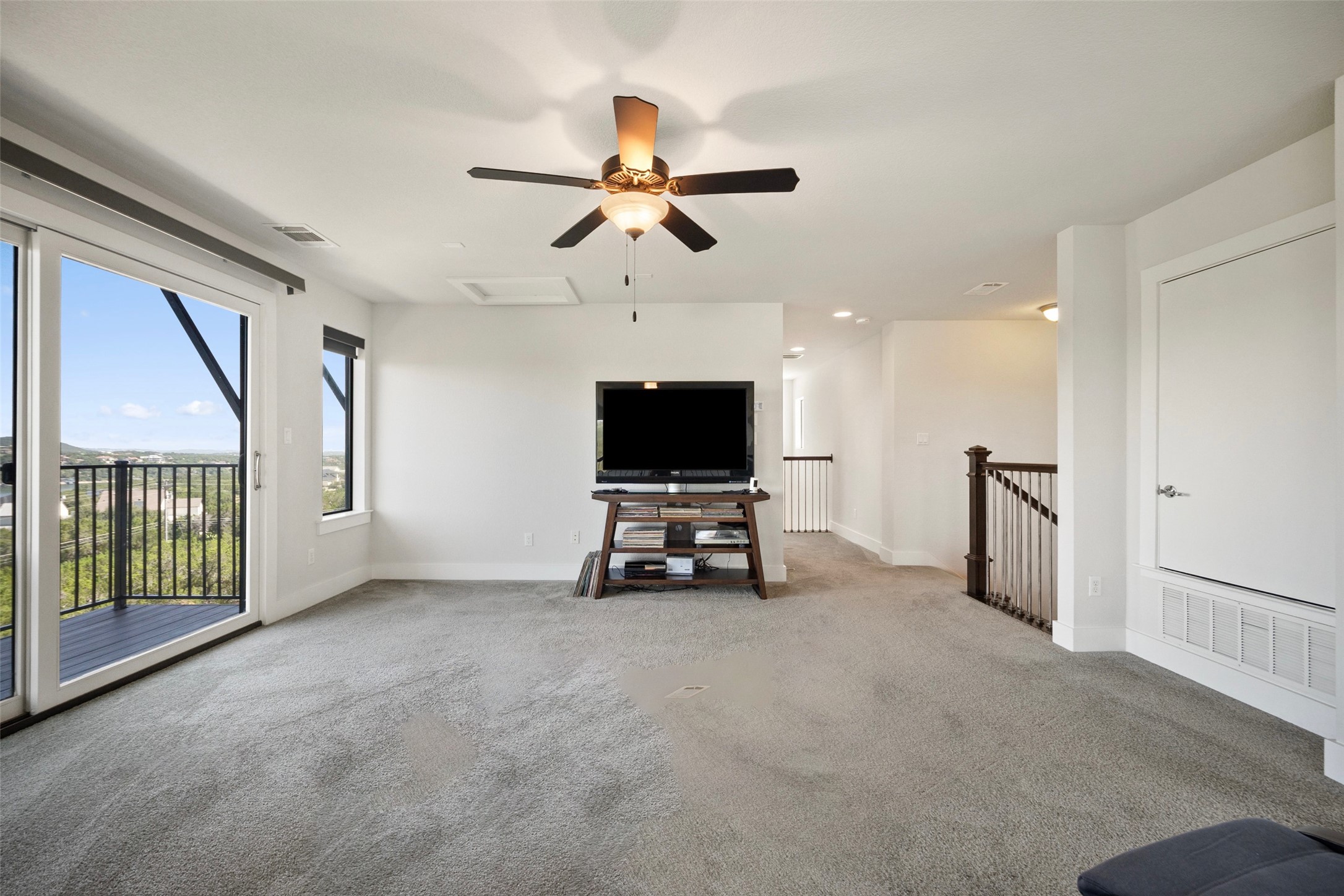 17644 West Reed Park Road Jonestown, TX 78645 - Photo 28 of 36 a living room with furniture and a flat screen tv