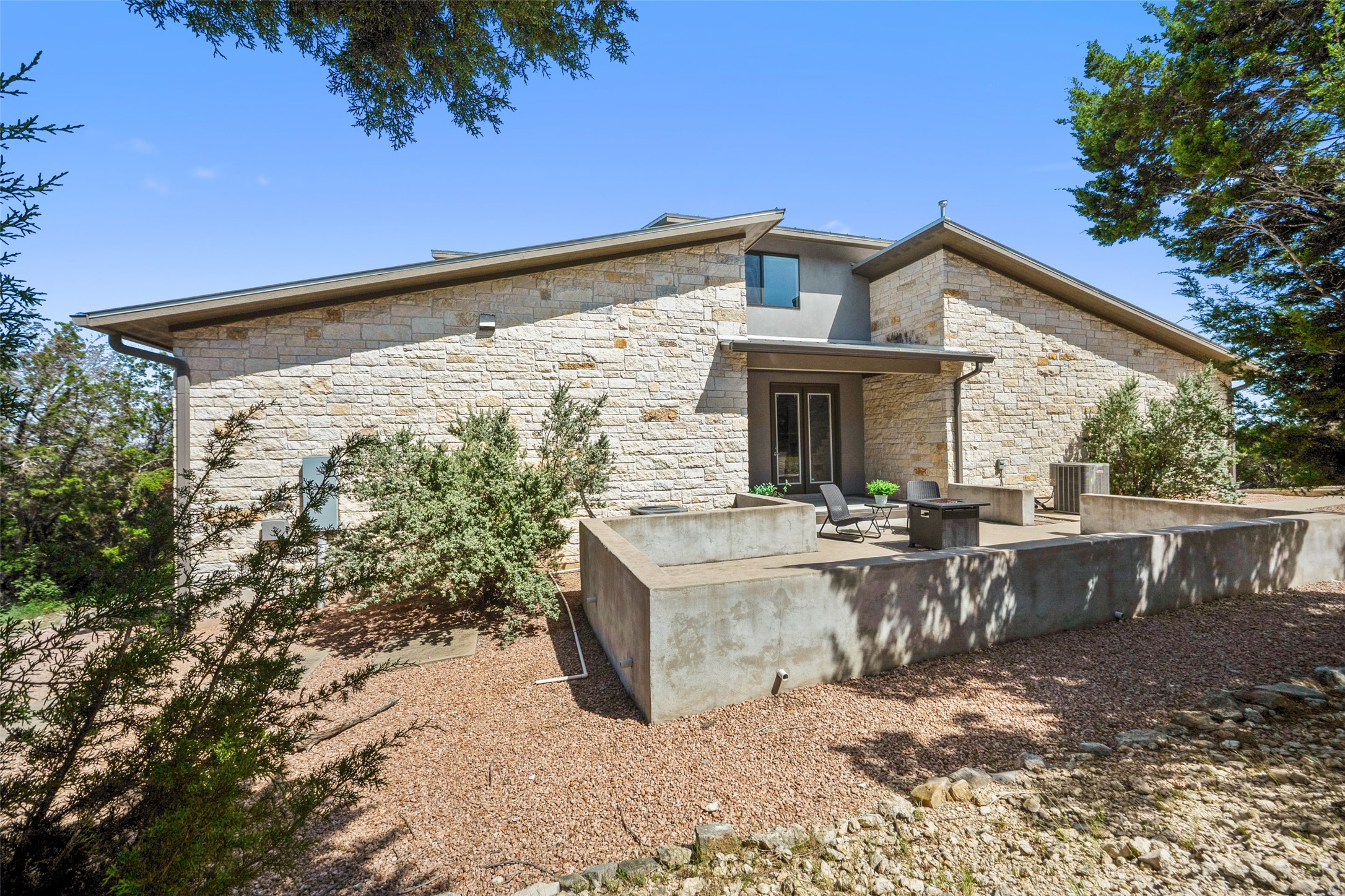 17644 West Reed Park Road Jonestown, TX 78645 - Photo 29 of 36 a view of a two chairs and table in the patio