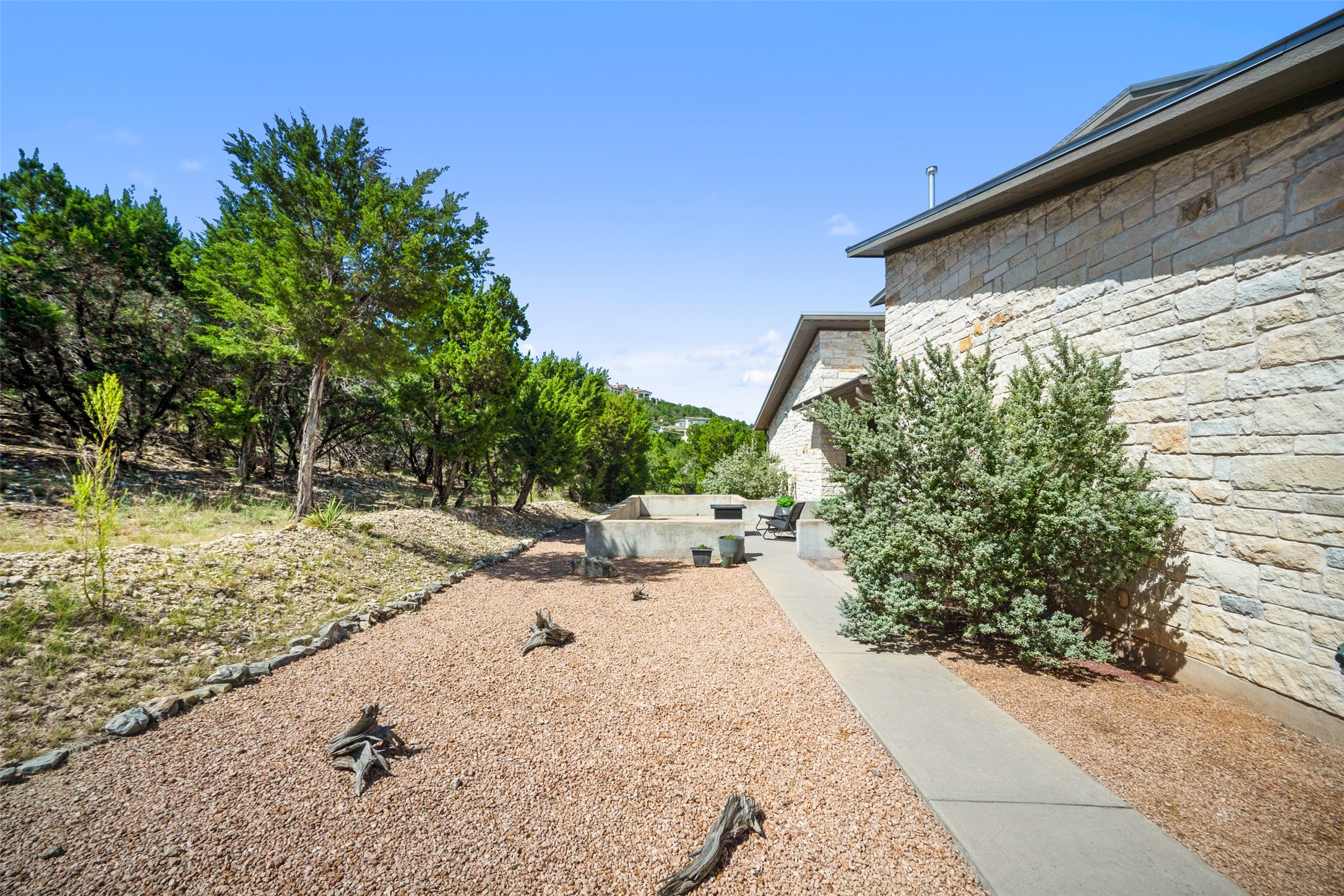 17644 West Reed Park Road Jonestown, TX 78645 - Photo 31 of 36 a view of a backyard with pathway