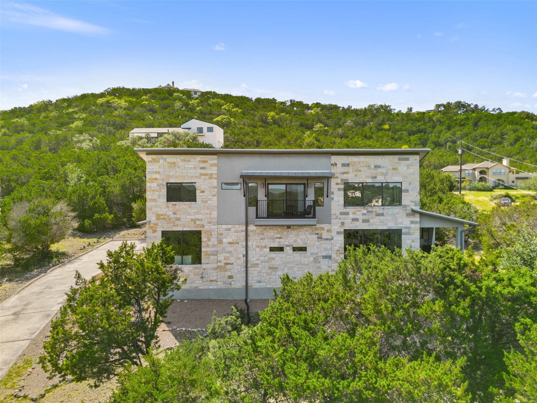 17644 West Reed Park Road Jonestown, TX 78645 - Photo 5 of 36 a view of a back yard of the house