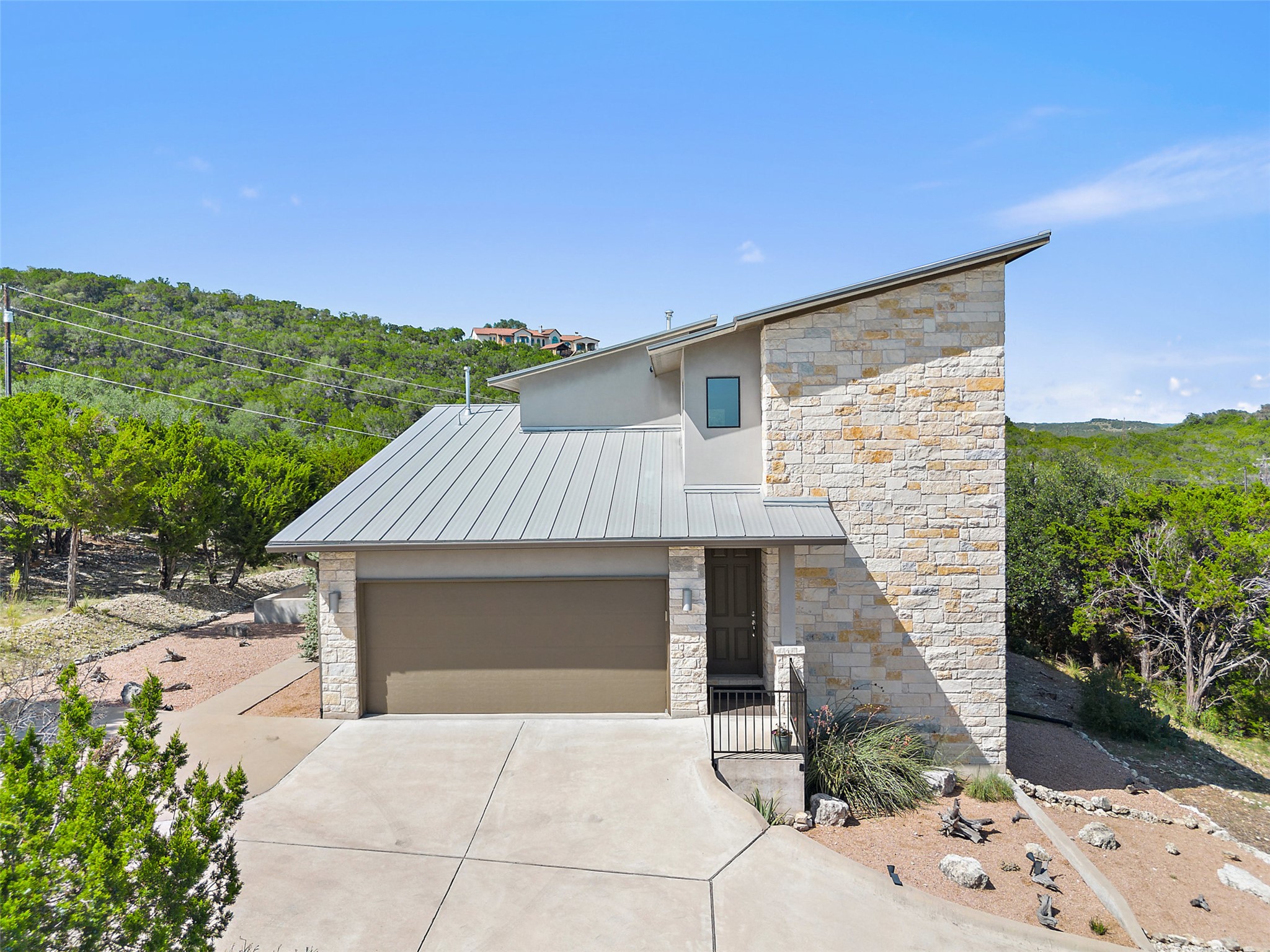 17644 West Reed Park Road Jonestown, TX 78645 - Photo 9 of 36 a front view of a house with a yard