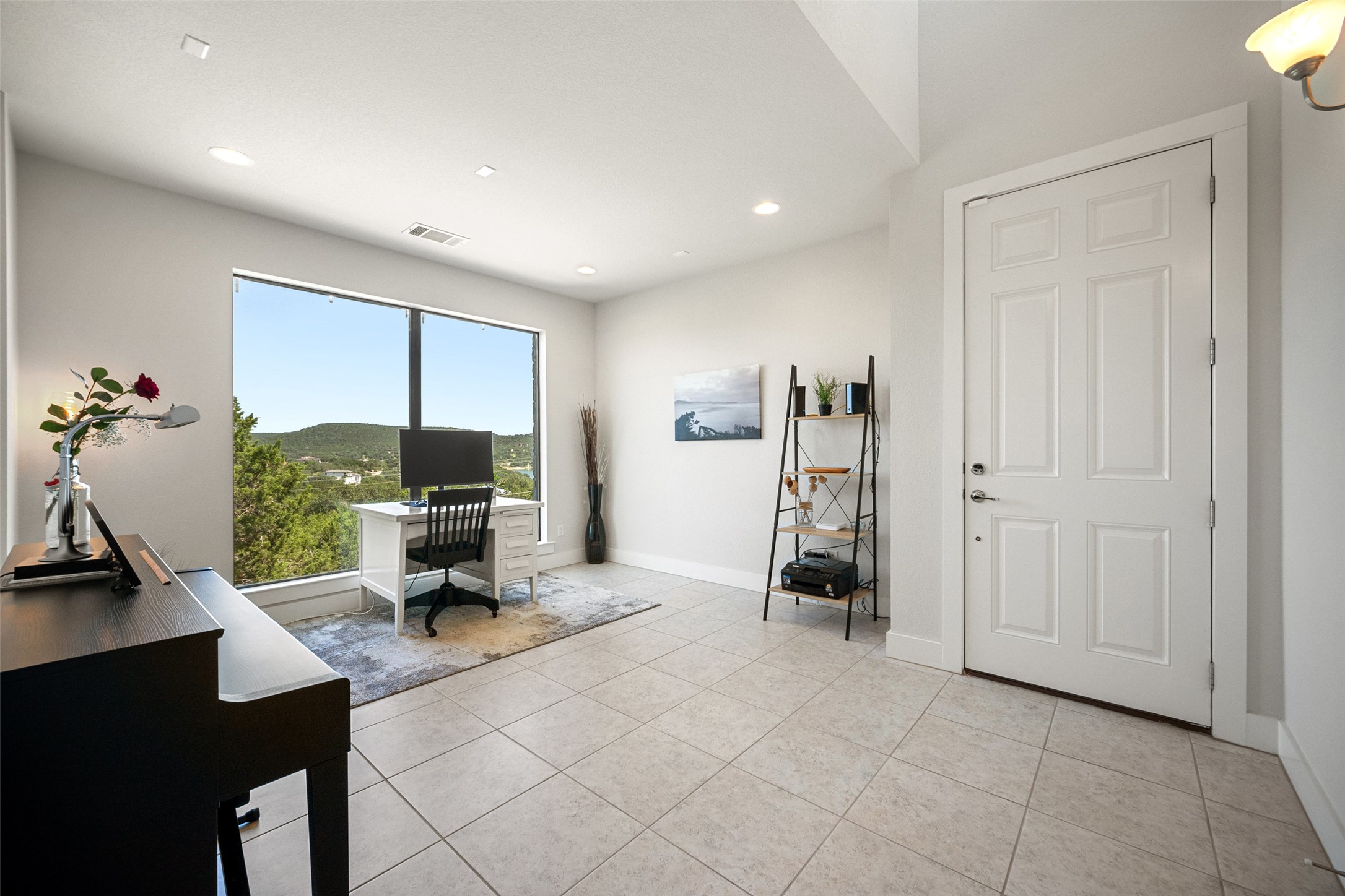 17644 West Reed Park Road Jonestown, TX 78645 - Photo 10 of 36 a living room with furniture and a flat screen tv