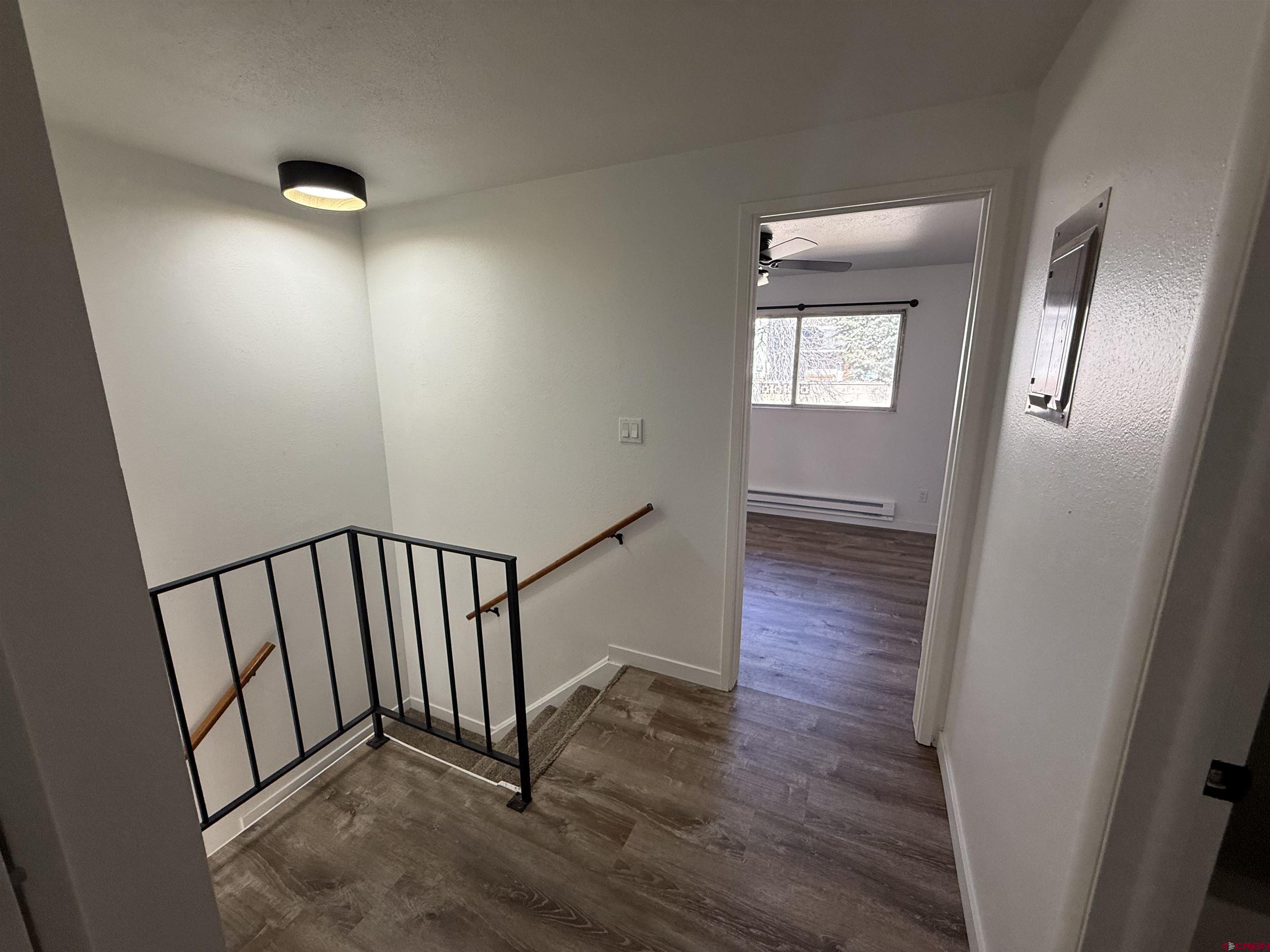 901 Florida Road, Unit 6 Durango, CO 81301 - Photo 4 of 21 a view of a hallway with wooden floor