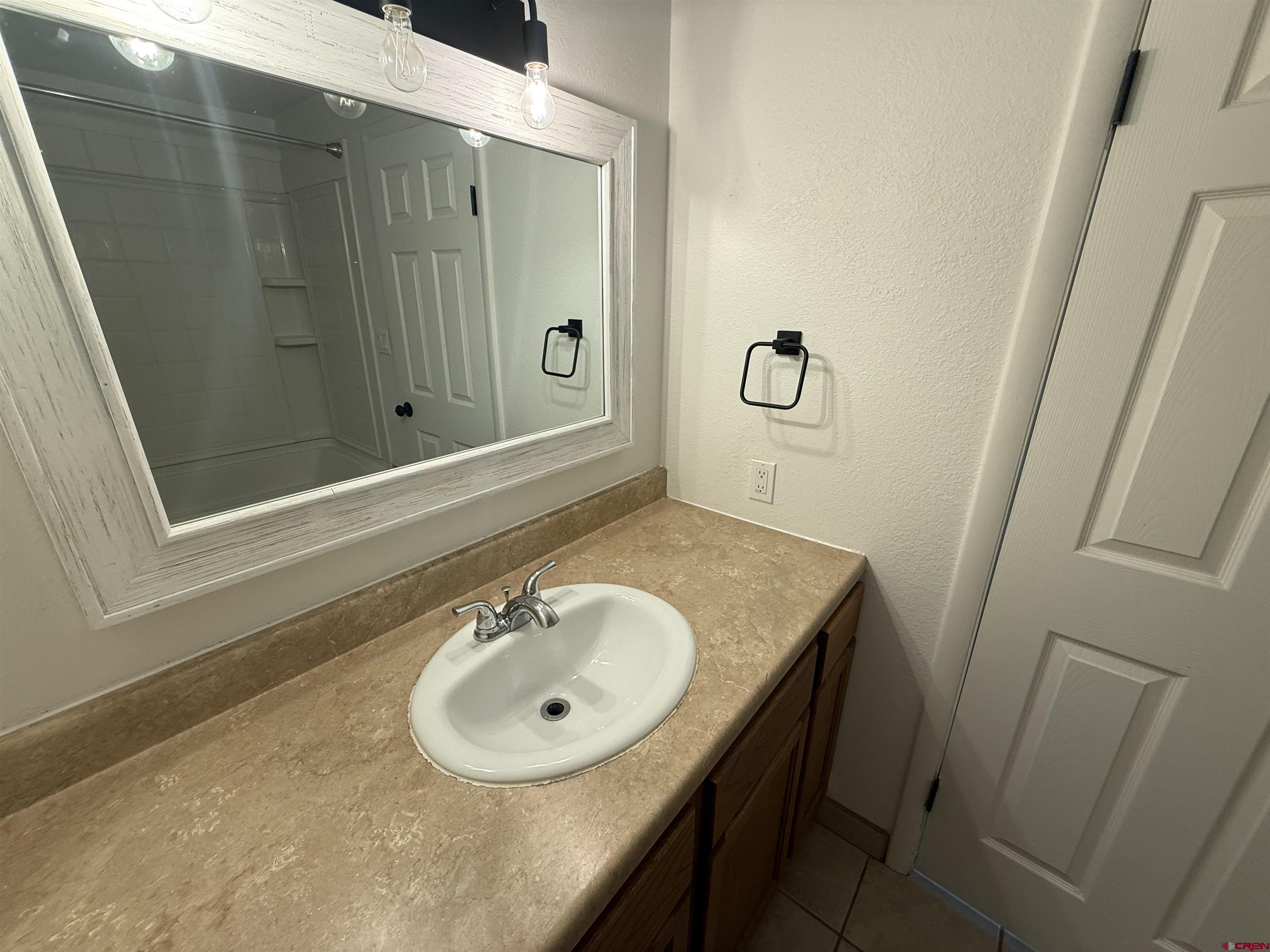 901 Florida Road, Unit 6 Durango, CO 81301 - Photo 8 of 21 a bathroom with a sink and a mirror