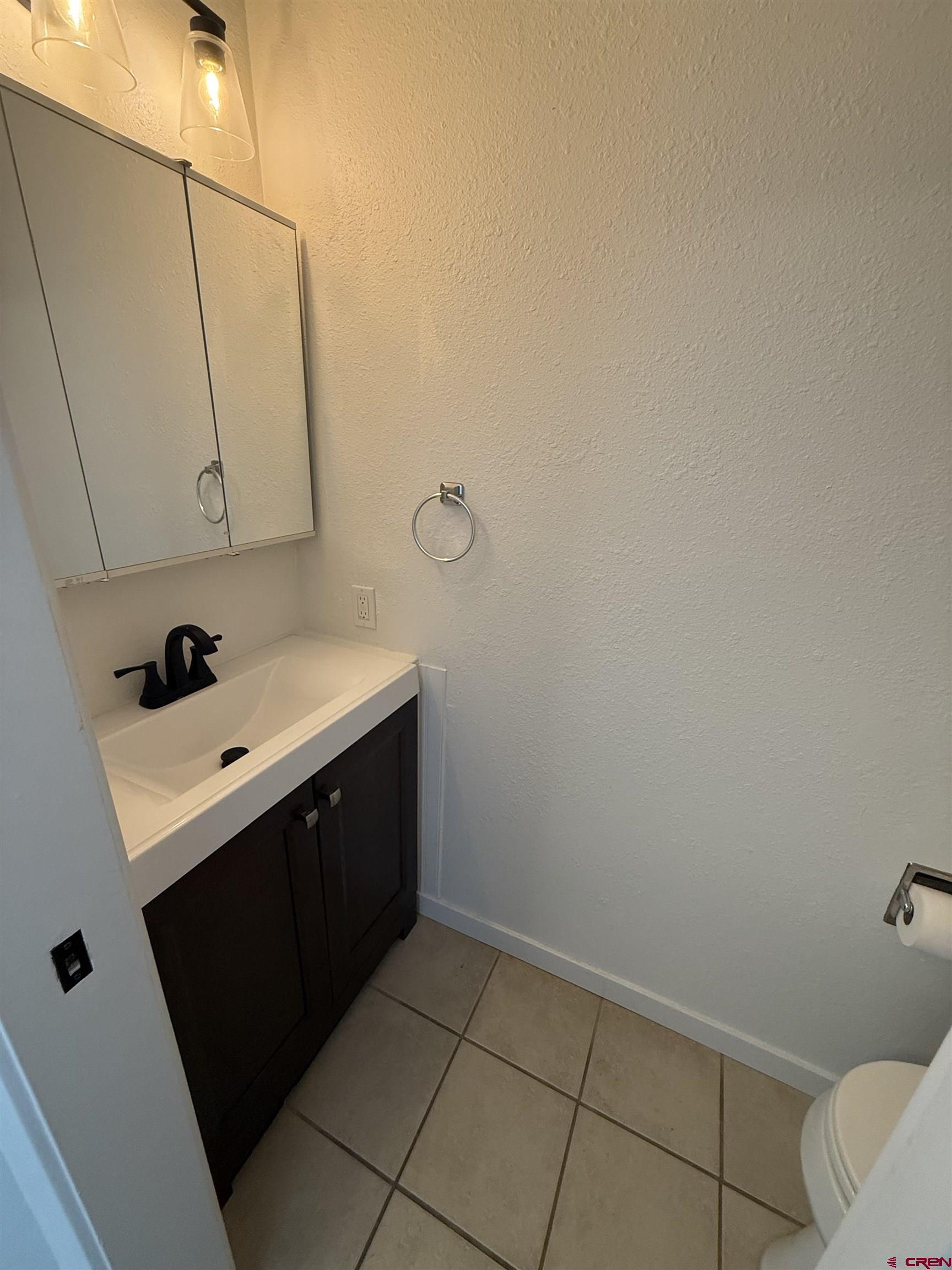 901 Florida Road, Unit 6 Durango, CO 81301 - Photo 9 of 21 a bathroom with a sink vanity and mirror