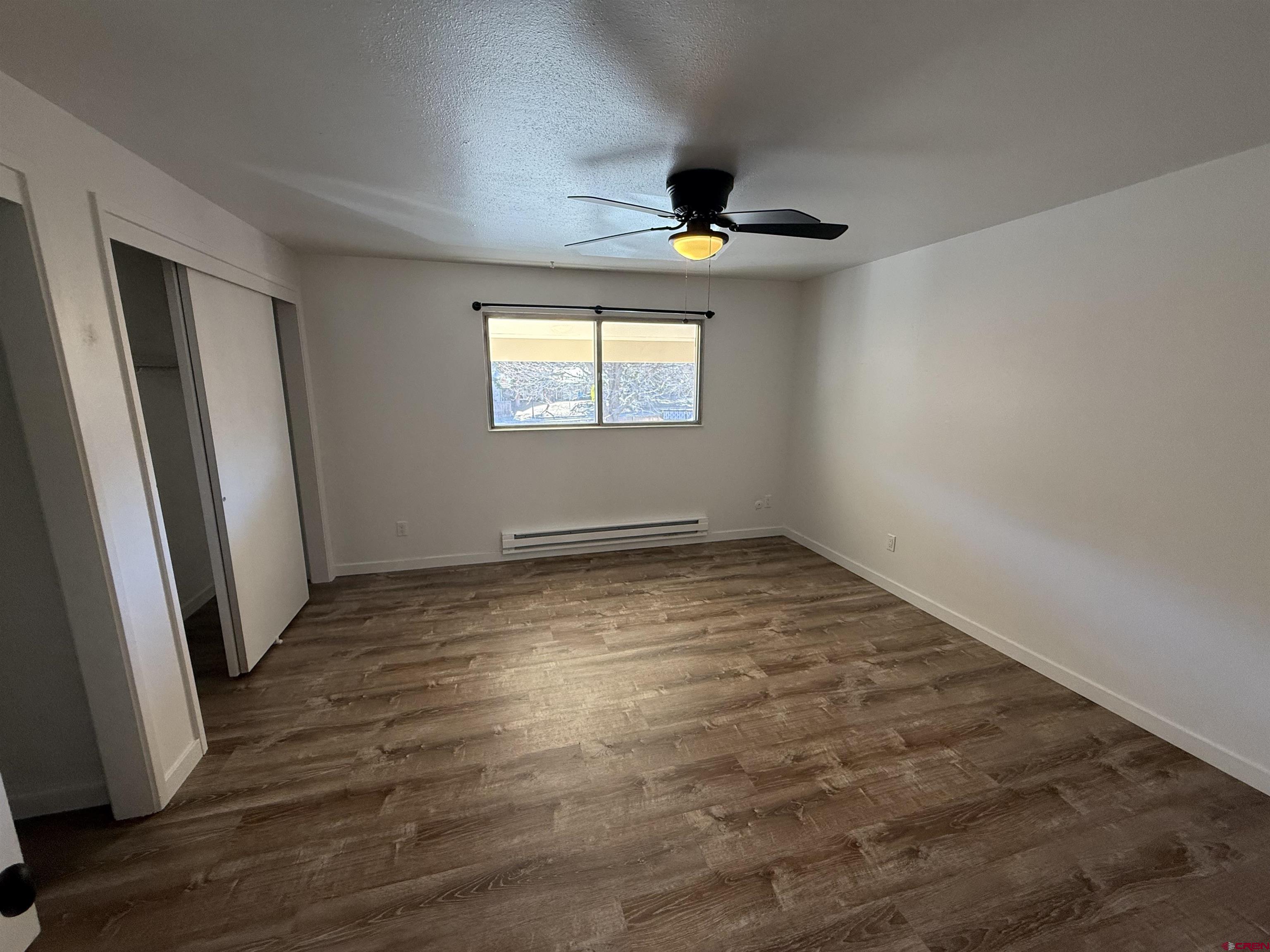 901 Florida Road, Unit 6 Durango, CO 81301 - Photo 10 of 21 an empty room with wooden floor and window