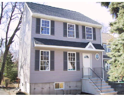 15 Grove Road Waltham, MA 02451 - Photo 1 of 1 a front view of a house with a yard