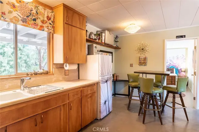 a view of a dining table and chairs in a room