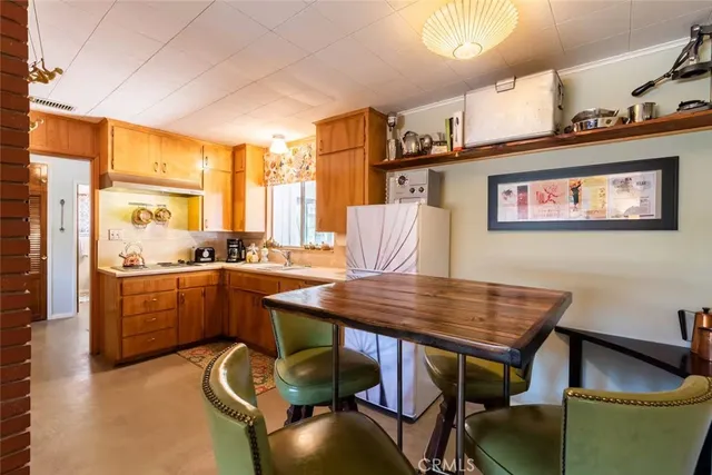 a dinning table and chairs in a room