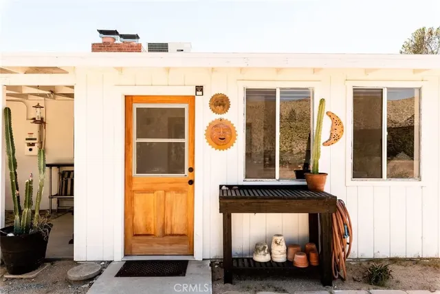 a front view of a house with a large window