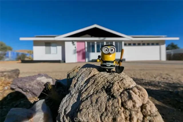 a front view of a house with sitting area