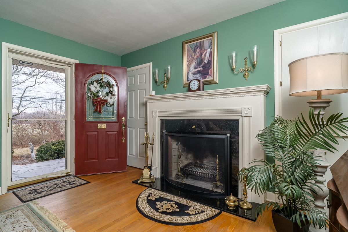 2769 Airport Road Bridgewater, VA 22812 - Photo 13 of 70 a living room with a fireplace a potted plant and a fireplace