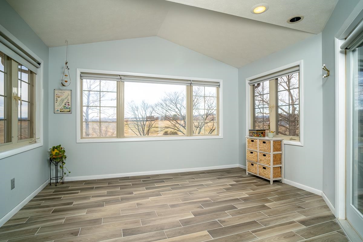 2769 Airport Road Bridgewater, VA 22812 - Photo 19 of 70 an empty room with wooden floor and windows
