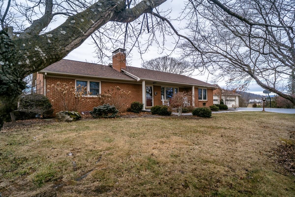 2769 Airport Road Bridgewater, VA 22812 - Photo 2 of 70 a front view of a house with a garden