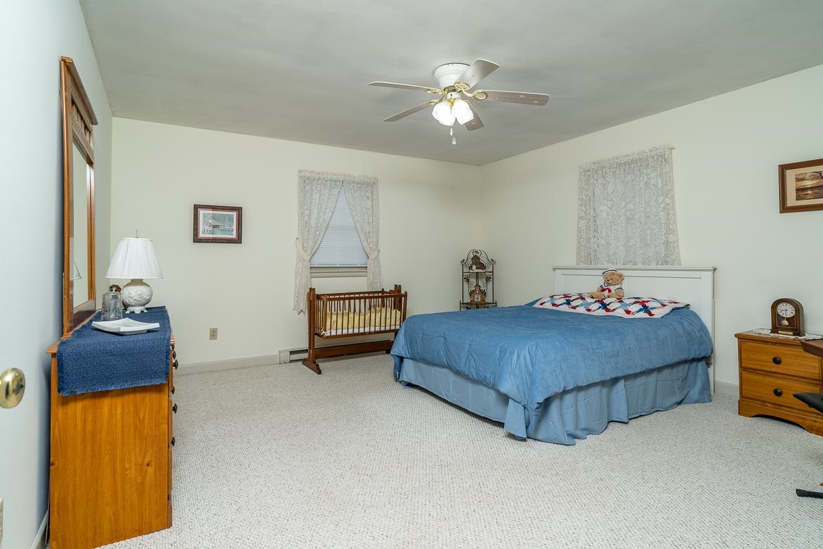 2769 Airport Road Bridgewater, VA 22812 - Photo 21 of 70 a bedroom with a bed and a chandelier