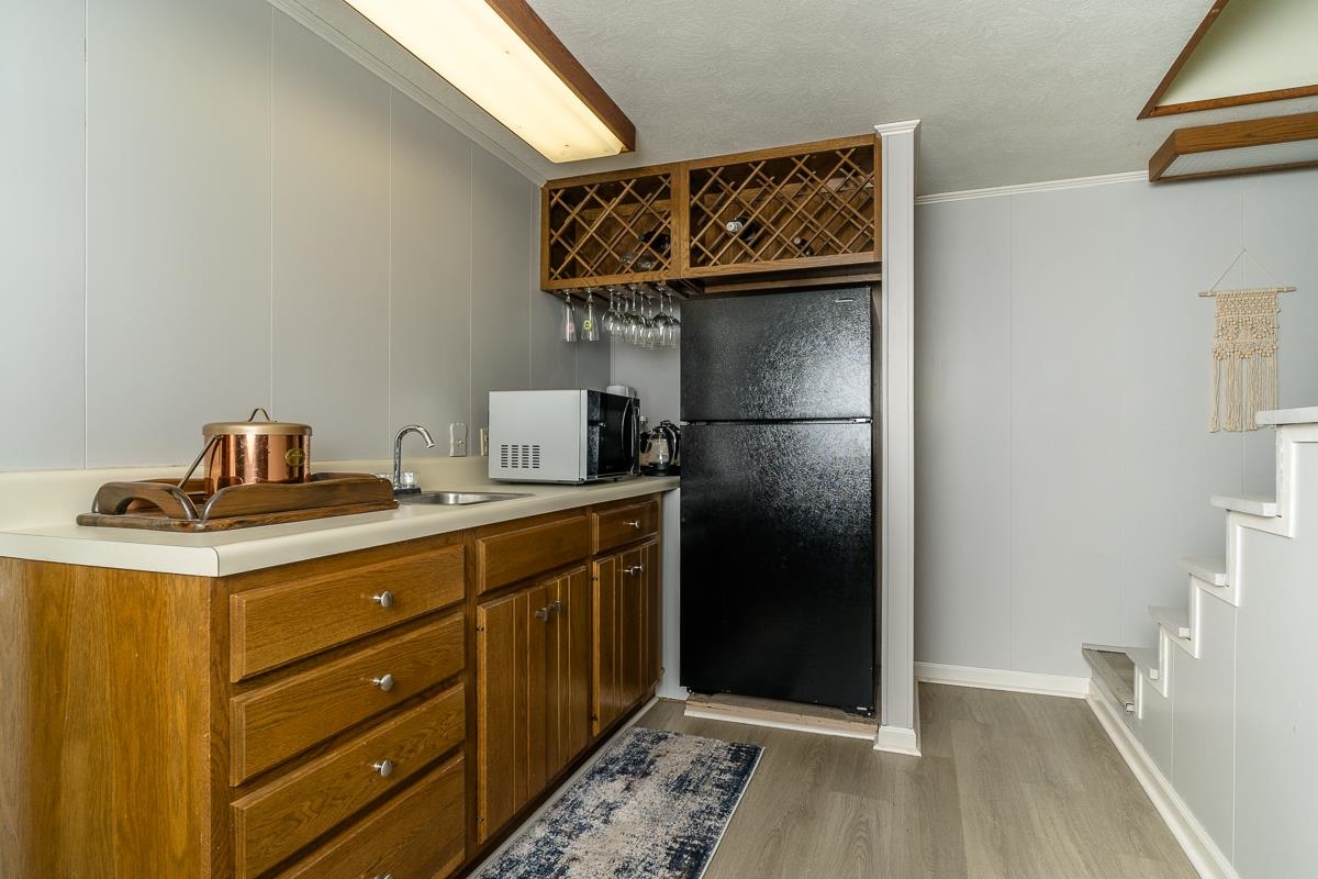 2769 Airport Road Bridgewater, VA 22812 - Photo 26 of 70 a kitchen with a refrigerator and cabinets