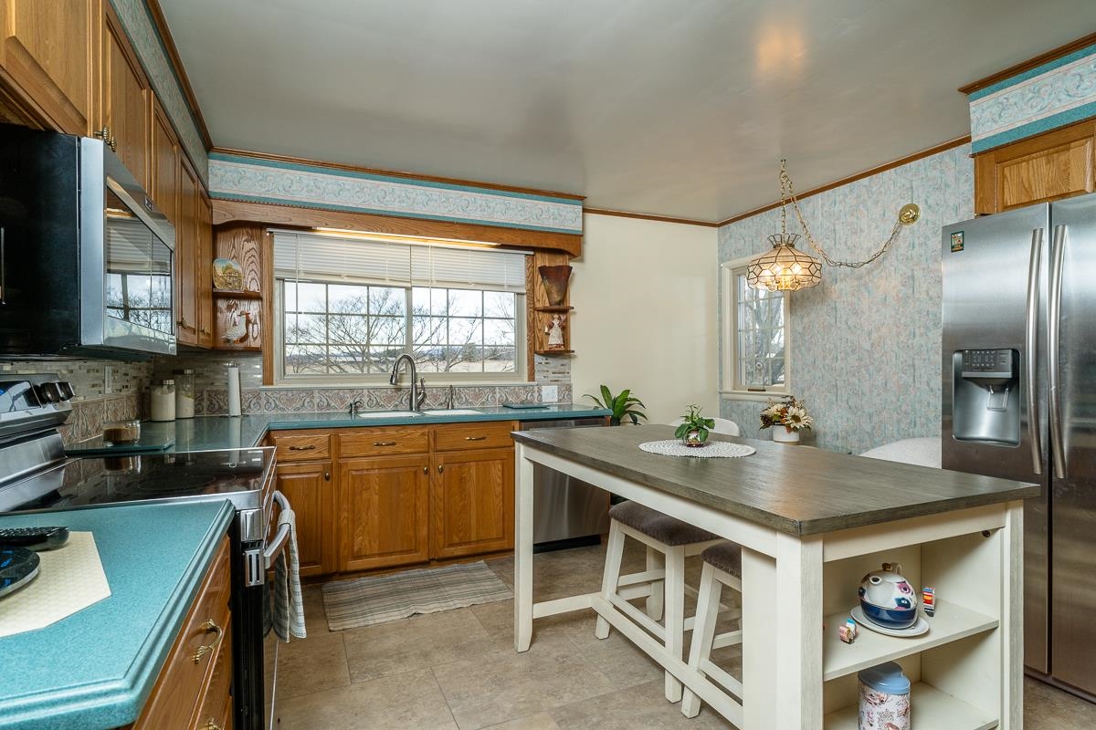 2769 Airport Road Bridgewater, VA 22812 - Photo 6 of 70 a kitchen with stainless steel appliances granite countertop a sink stove and refrigerator