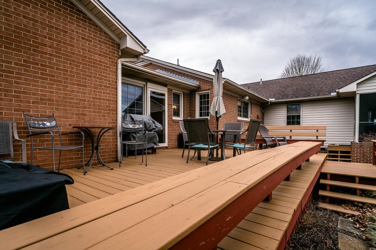 2769 Airport Road Bridgewater, VA 22812 - Photo 67 of 70 a view of a patio with table and chairs with wooden floor and fence