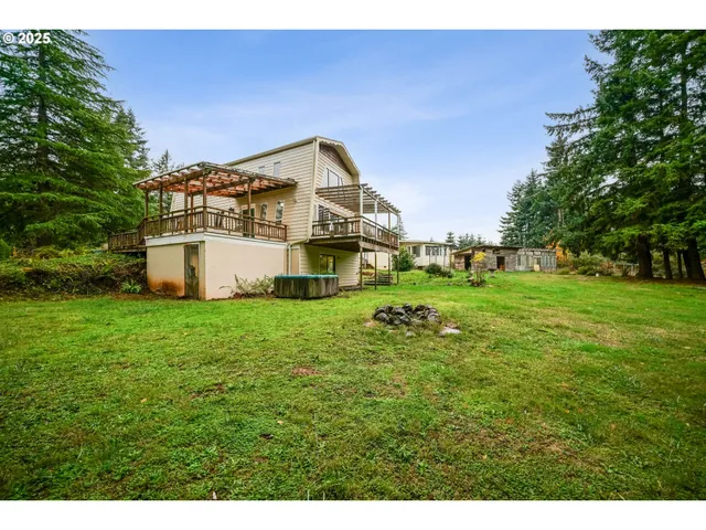 a backyard of a house with table and chairs
