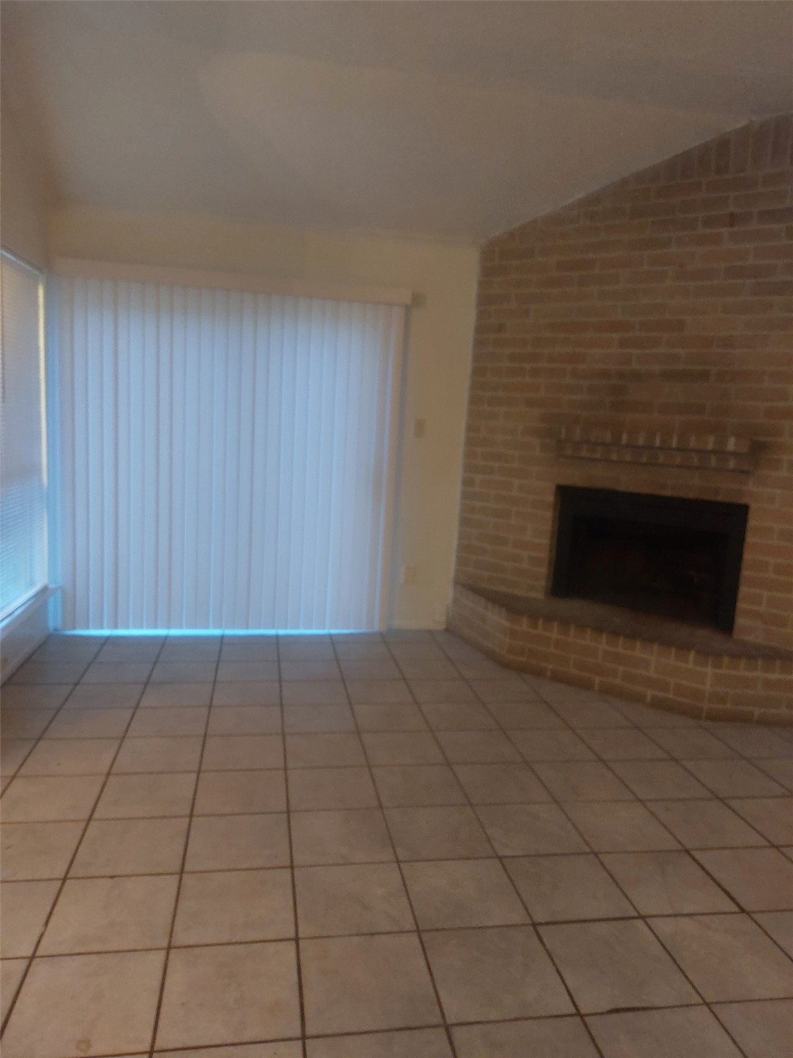 8151 Misty Ridge Lane Houston, TX 77071 - Photo 11 of 15 a view of an empty room with a fireplace