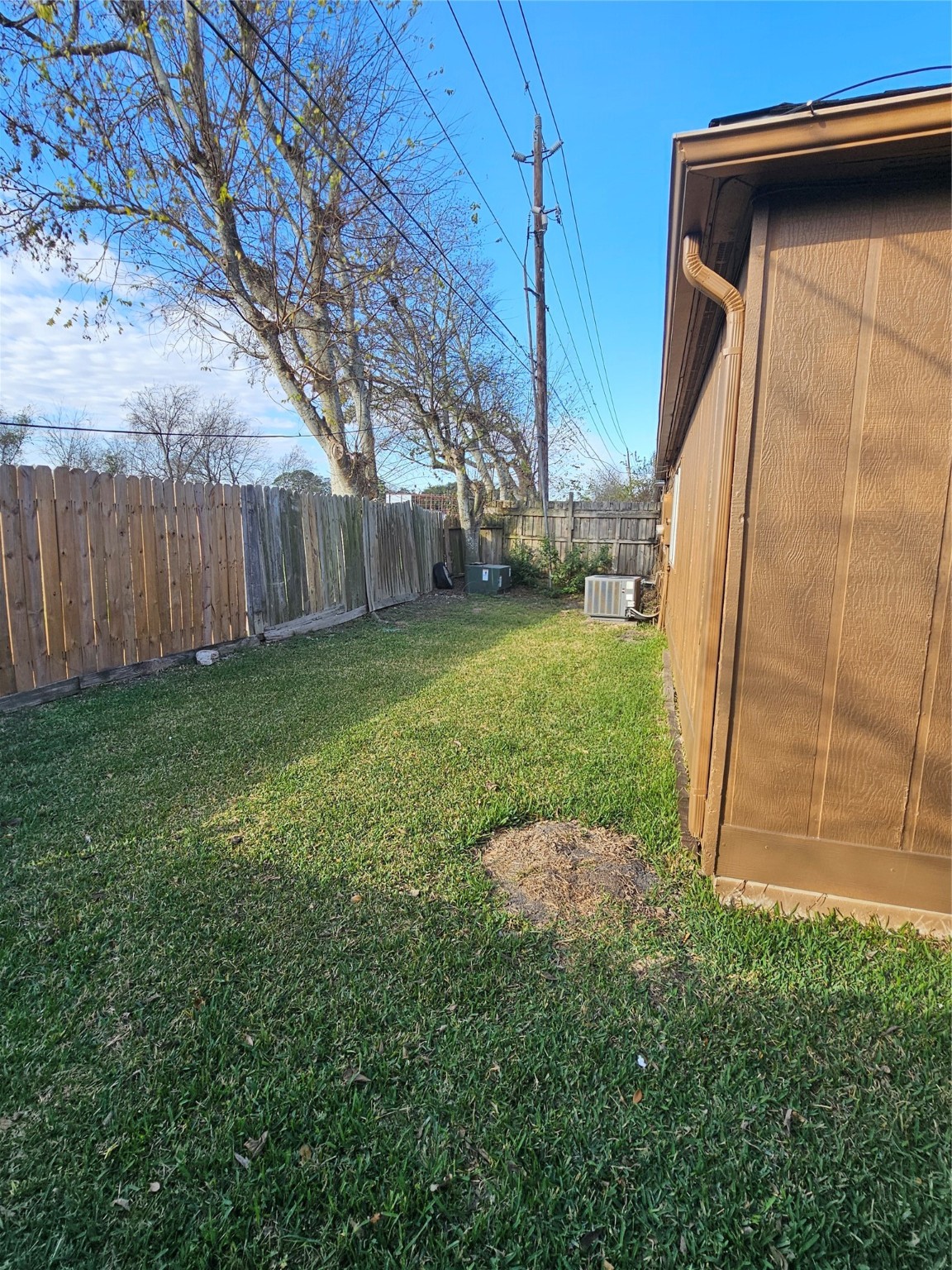 8151 Misty Ridge Lane Houston, TX 77071 - Photo 15 of 15 a view of a backyard with barn and wooden fence