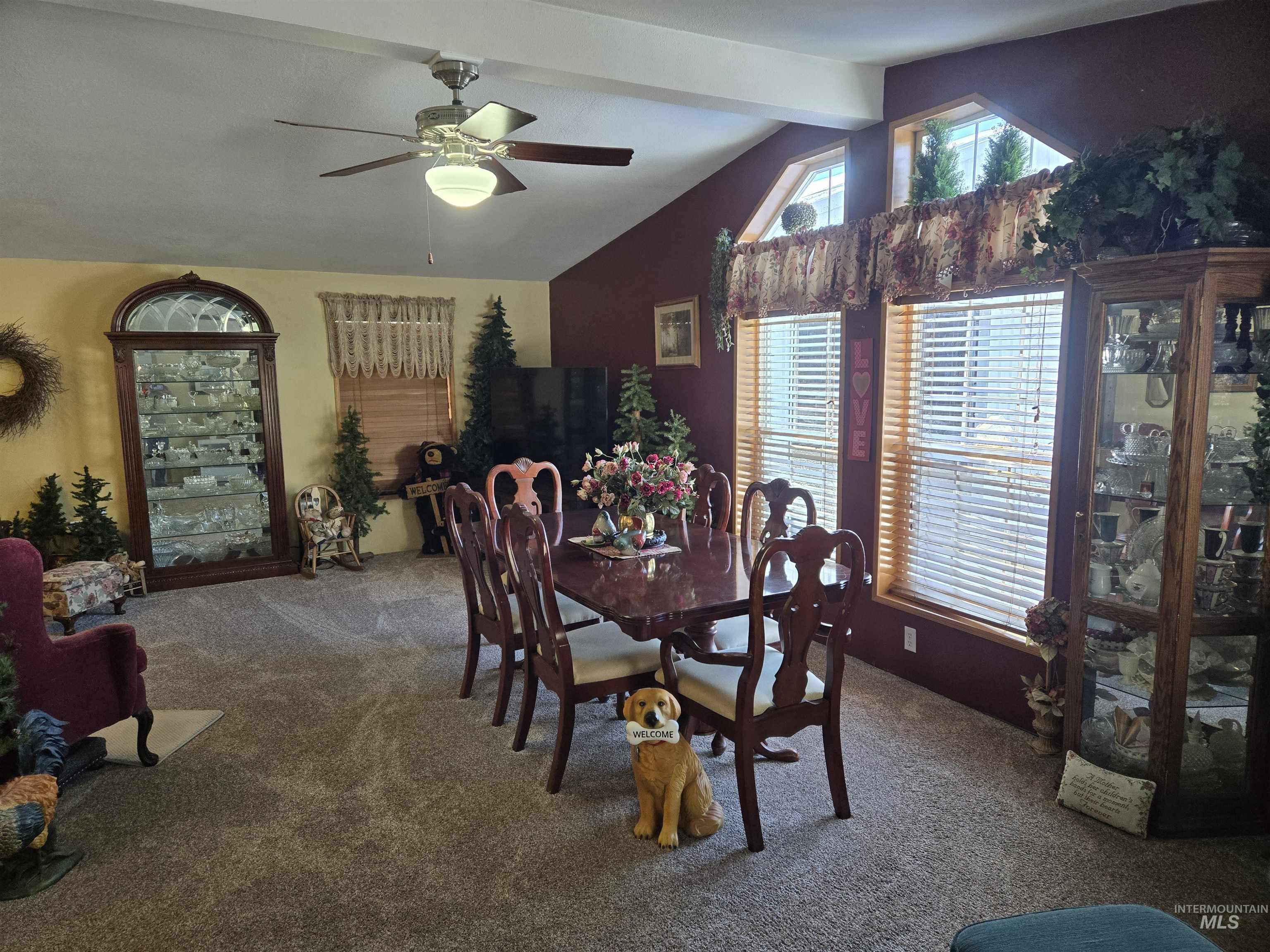 254 Lackey Road Weippe, ID 83553 - Photo 7 of 38 Carpeted dining room with a ceiling fan and vaulted ceiling with beams