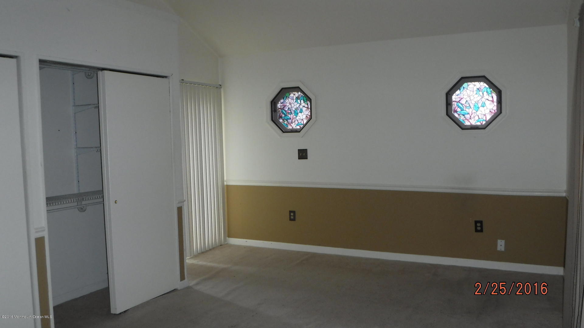 108 Toggle Road Manahawkin, NJ 08050 - Photo 11 of 11 a view of an empty room with a window