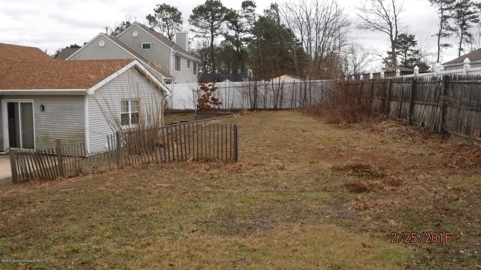108 Toggle Road Manahawkin, NJ 08050 - Photo 3 of 11 a view of a small house