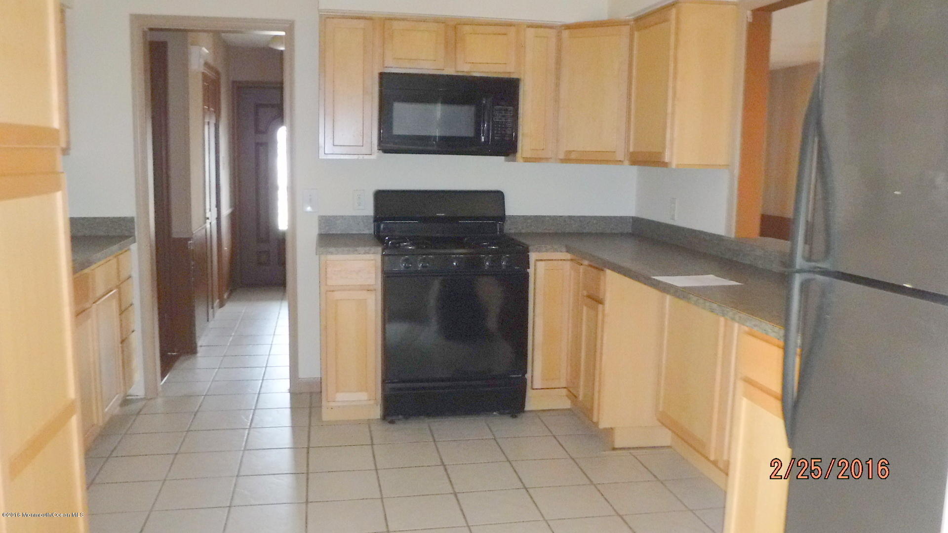 108 Toggle Road Manahawkin, NJ 08050 - Photo 5 of 11 a kitchen with a refrigerator and a stove