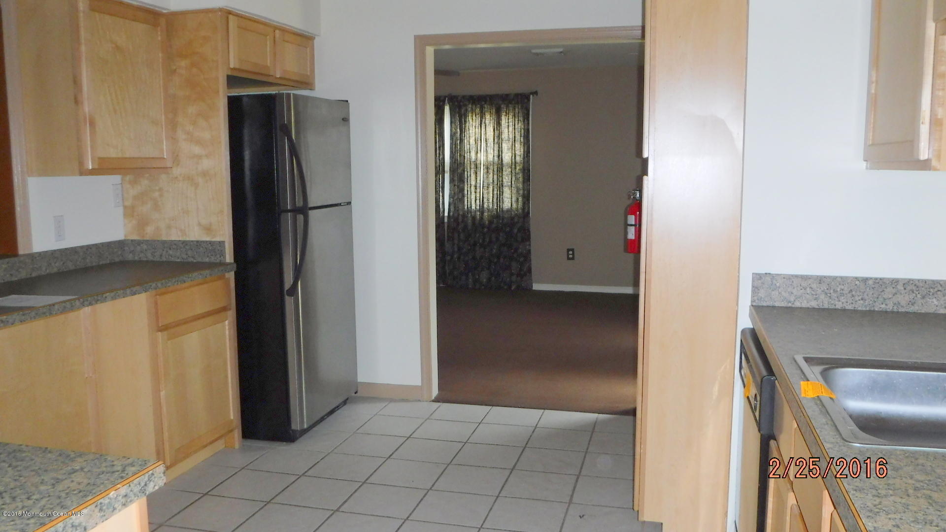 108 Toggle Road Manahawkin, NJ 08050 - Photo 6 of 11 a view of kitchen with furniture and refrigerator