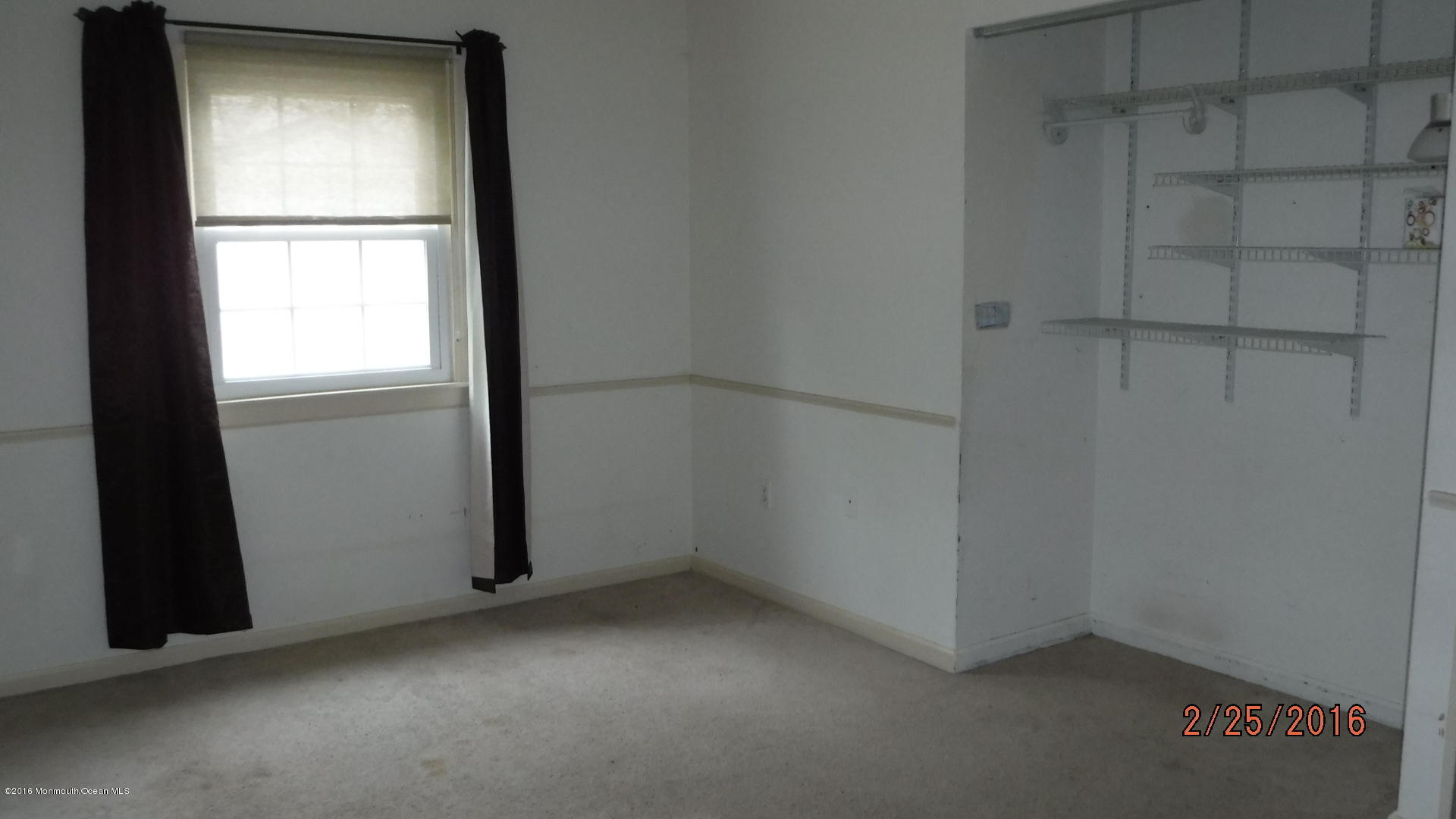 108 Toggle Road Manahawkin, NJ 08050 - Photo 9 of 11 an empty room with a window