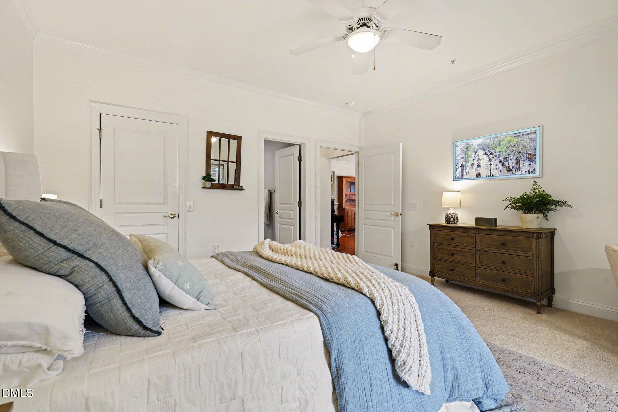 7530 Lead Mine Road, Unit 202 Raleigh, NC 27615 - Photo 11 of 36 a bedroom with a bed and a dresser