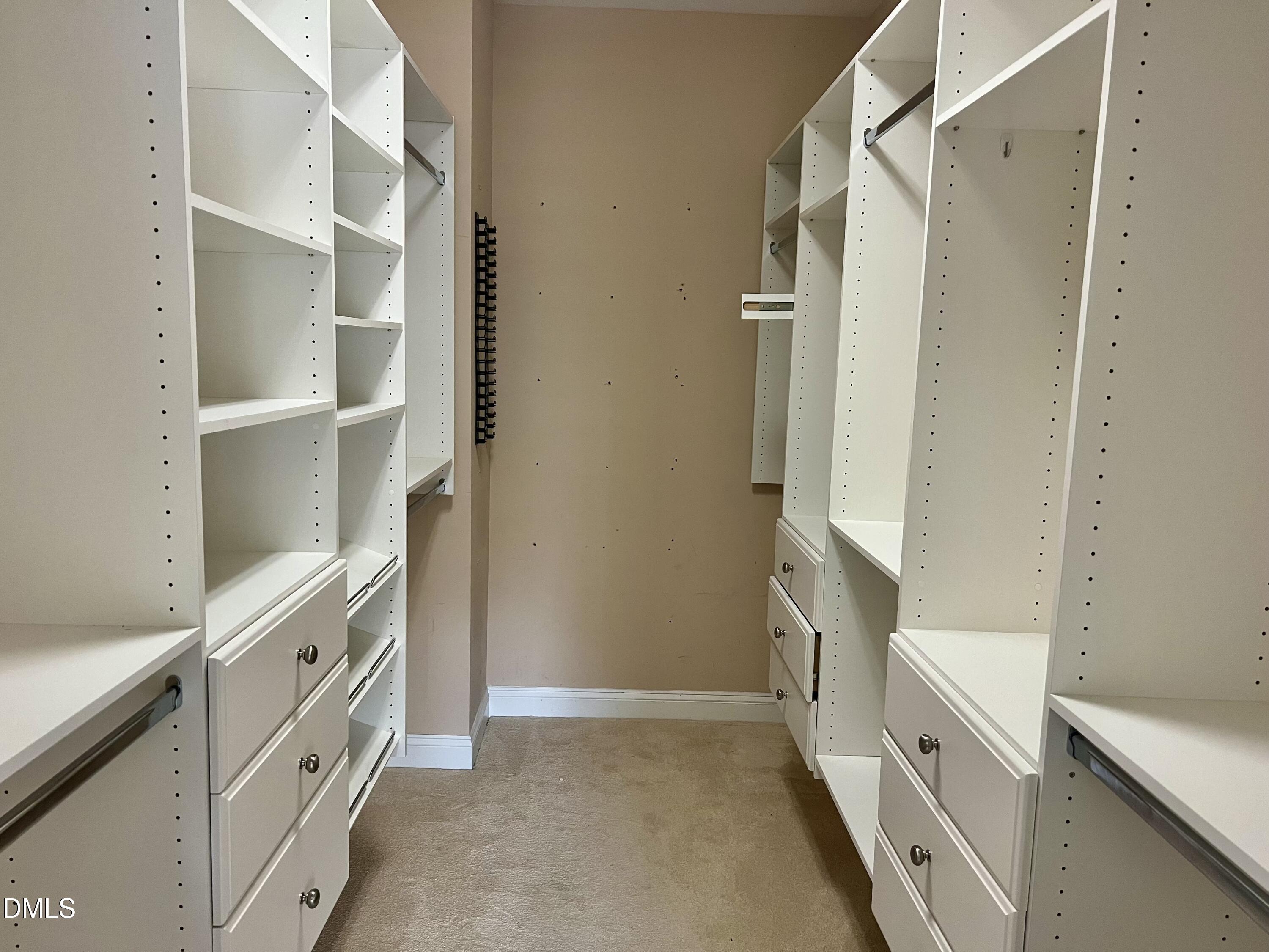 7530 Lead Mine Road, Unit 202 Raleigh, NC 27615 - Photo 13 of 36 a bathroom with a double vanity sink and a mirror