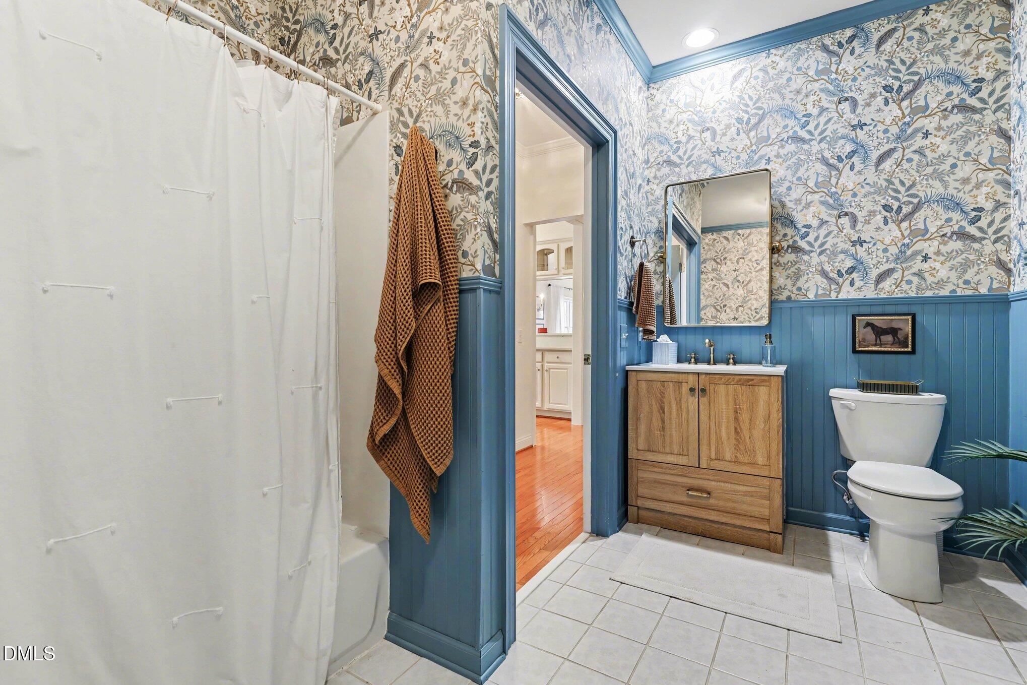 7530 Lead Mine Road, Unit 202 Raleigh, NC 27615 - Photo 16 of 36 a bathroom with a toilet and a shower