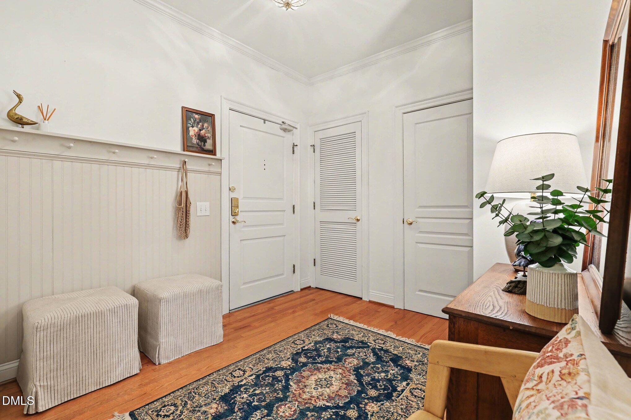 7530 Lead Mine Road, Unit 202 Raleigh, NC 27615 - Photo 17 of 36 a bedroom with a bed and a potted plant