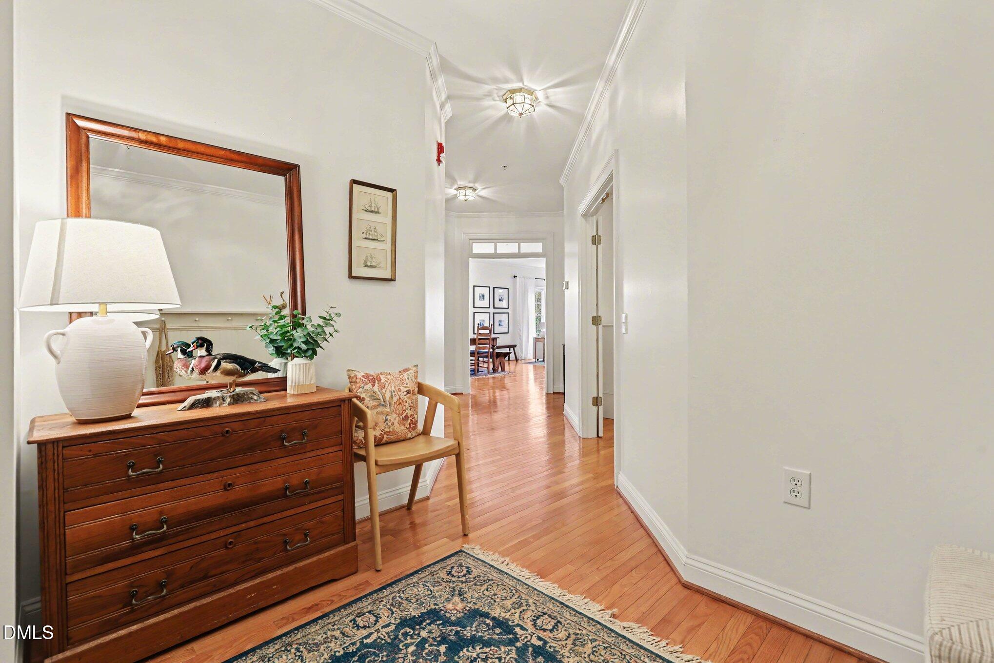 7530 Lead Mine Road, Unit 202 Raleigh, NC 27615 - Photo 19 of 36 a living room with furniture and a mirror