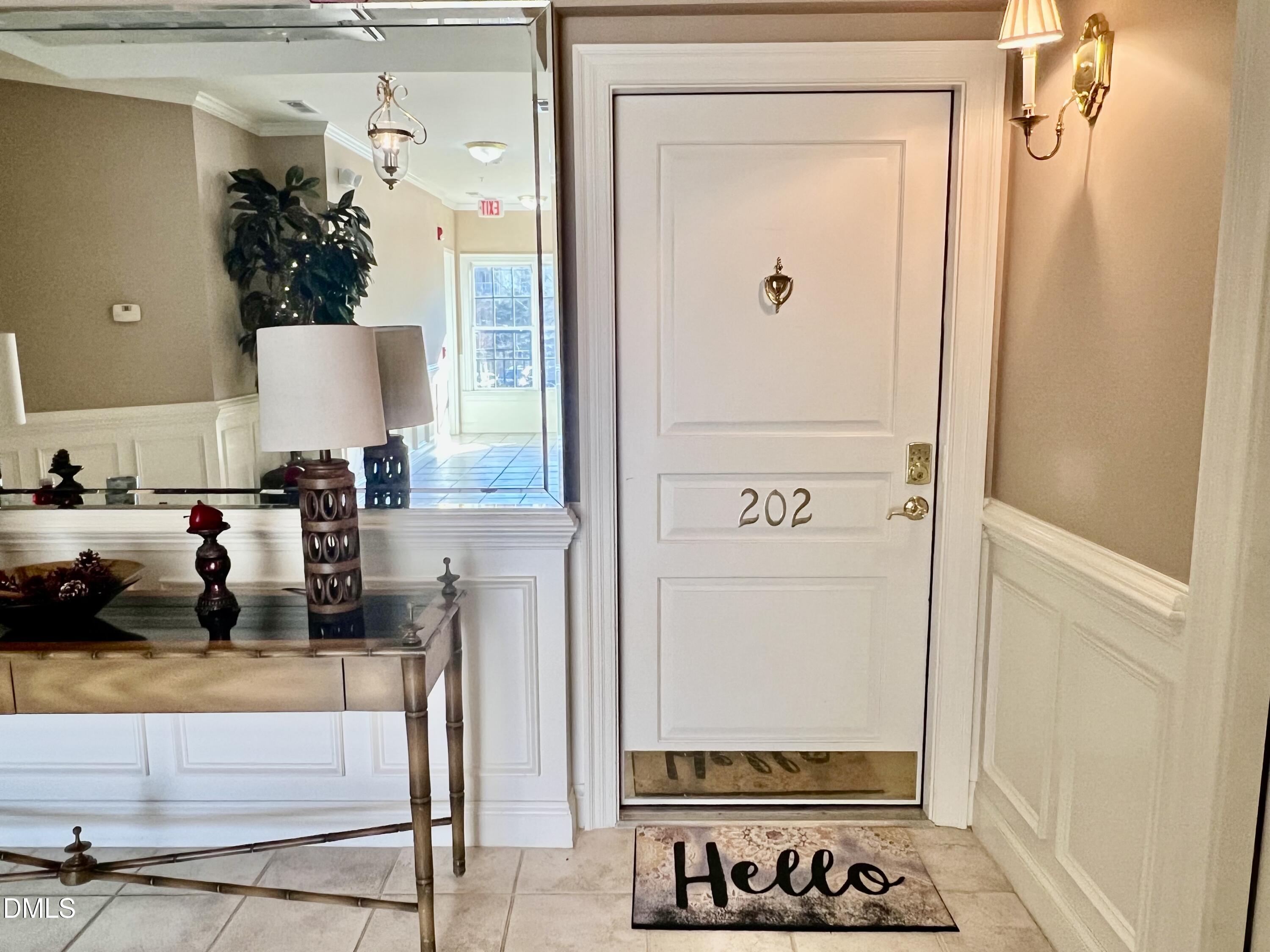 7530 Lead Mine Road, Unit 202 Raleigh, NC 27615 - Photo 21 of 36 view of living room with furniture and a mirror
