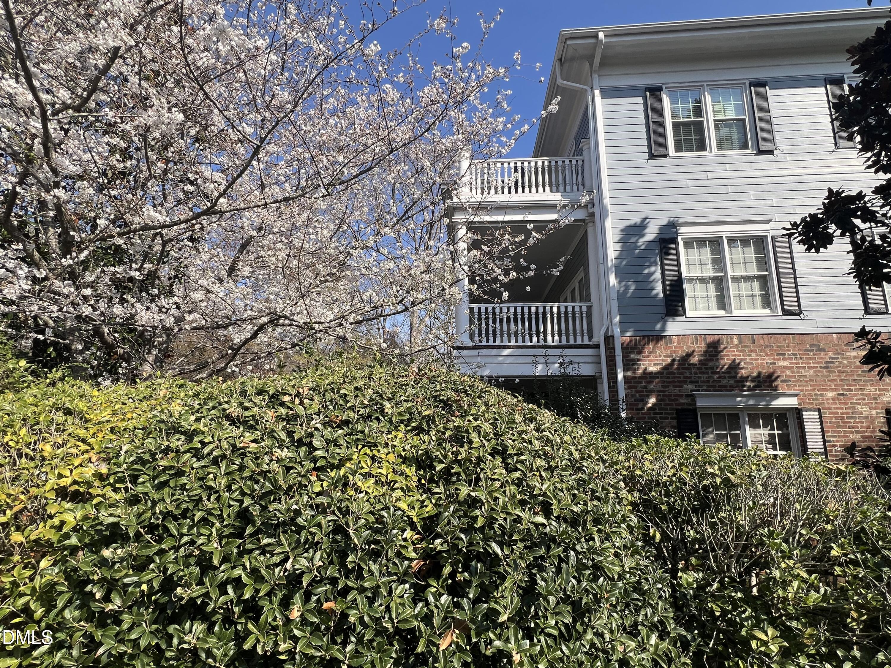 7530 Lead Mine Road, Unit 202 Raleigh, NC 27615 - Photo 27 of 36 a house view with a garden space